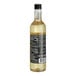 A close up of a bottle of DaVinci Gourmet Classic Hazelnut Flavoring Syrup with a black label.