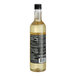 A clear glass bottle of DaVinci Gourmet Classic Hazelnut Flavoring Syrup with a black cap and nutrition label.