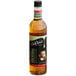 A close-up of a bottle of DaVinci Gourmet Irish Cream flavoring syrup with brown liquid inside.