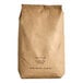 A brown bag of Grain Millers Whole Grain Oat Flour with black text.