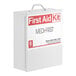A white Medique first aid kit cabinet with red text.