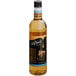 A close up of a bottle of DaVinci Gourmet Sugar-Free English Toffee Flavoring Syrup with brown liquid inside.