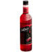 A close up of a DaVinci Gourmet Classic Cherry Flavoring syrup bottle with a red label.