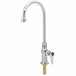 A silver T&S deck-mount faucet with a blue sticker.