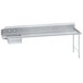 An Advance Tabco stainless steel dishtable with a shelf on the right.