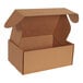 A brown box with a white top and open front locking tabs.