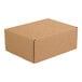 A brown cardboard Lavex Kraft mailer box.