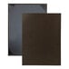A close-up of two brown H. Risch, Inc. linen menu covers with black trim.