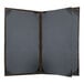 A grey rectangular menu cover with a brown border.