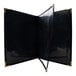 A black linen menu cover with gold corners.