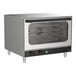 A stainless steel full size countertop convection oven with a glass door and control knobs on the front panel.
