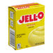 A yellow box of JELL-O Instant Lemon Pudding Mix on a counter.