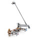 A T&S chrome mop sink faucet with a long handle and a hose outlet.