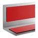 A stainless steel wall corner guard with red protective strips.