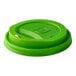 A green compostable plastic sip lid designed for 8 oz. hot cups.