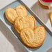 A plate with three palm leaf-shaped puff pastries.