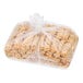 A plastic wrapped Finger Food Products Buffalo-Style Chicken Log Egg Roll.