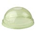 A green compostable plastic dome lid with a straw hole designed for cold cups.