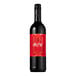A close-up of a Noughty Non-Alcoholic Rouge Syrah wine bottle with a red label.