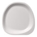 A close-up of a Jungle Stone sugarcane pulp plate with a rounded edge.