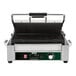 A Waring Panini Supremo grill with a handle and a timer dial.