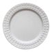 A close up of a white Jungle Decor sugarcane pulp plate with a diamond pattern.
