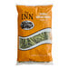 A 2-pound bag of whole green beans in orange packaging labeled 'The Inn'.