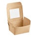 A brown paper take-out box with a white square window.