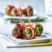A plate of bacon wrapped Simplot Simple Goodness Brussels sprouts.