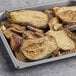 A tray of individually quick frozen grilled eggplant slices.