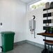 A Rinnai liquid propane tankless water heater with a green light.