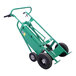 A green battery-powered steel drum truck with four wheels and a chime hook for handling fiber drums.