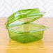 A green Eco-Products clear plastic container with a hinged lid.