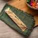 A white Eco-Products compostable paper spoon with a green wrapper.