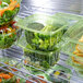 A group of Eco-Products green rectangular deli containers filled with broccoli and other vegetables.