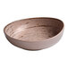An Ariane Tornado porcelain bowl with a speckled surface and a brown and white pattern.