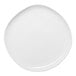 An Ariane Earth white porcelain plate with a round edge.