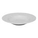 A white round porcelain plate with an embossed wide rim and deep center.