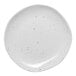 A white Ariane Earth porcelain plate with black specks.