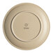 A white Ariane porcelain plate with a sand dollar design on the rim.