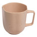 An Ariane dark sand porcelain mug with speckled dots.