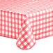 A rectangular red and white gingham vinyl table cover with a flannel back.