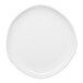An Ariane Earth white porcelain plate with a round edge on a white surface.