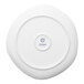 An Ariane flat porcelain plate with a blue logo on the rim.