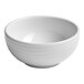 A small white embossed porcelain bowl.
