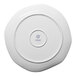 An Ariane Earth white porcelain plate with a circular hole in the center.