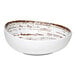 An Ariane white porcelain bowl with brown specks.