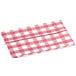 A folded burgundy and white gingham vinyl table cover with a flannel back.