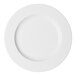 A round, wide-rimmed, warm white porcelain plate.