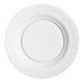 A round, wide-rimmed, warm white porcelain plate.
